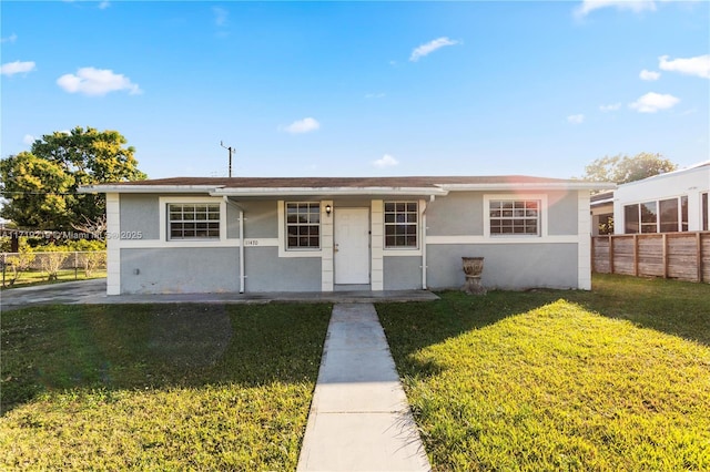 ranch-style home with a front yard