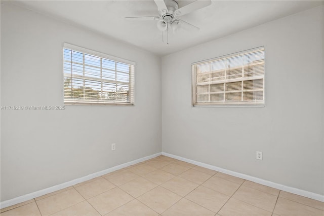 tiled empty room with ceiling fan