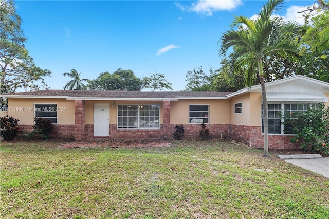 ranch-style home with a front yard