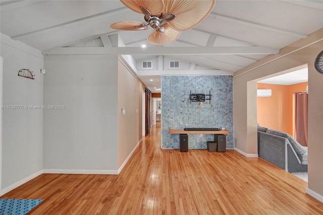 unfurnished living room featuring hardwood / wood-style flooring, ceiling fan, and vaulted ceiling with beams