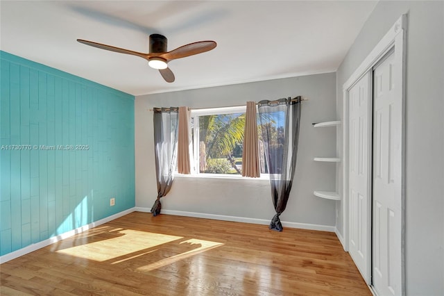 interior space with ceiling fan and light hardwood / wood-style floors