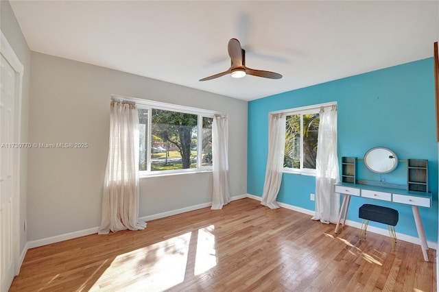 interior space featuring ceiling fan and light wood-type flooring