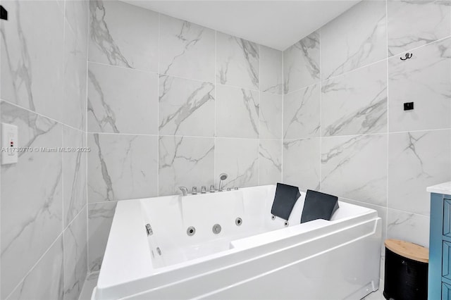 bathroom with vanity and a bathing tub