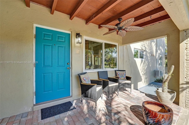 property entrance with ceiling fan and a patio area