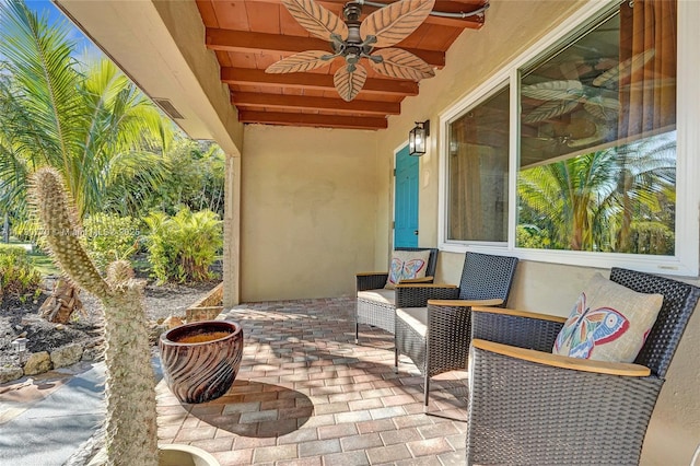 view of patio featuring ceiling fan