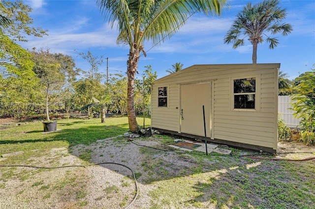 view of outbuilding with a lawn