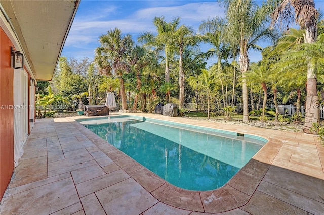 view of swimming pool featuring a patio area