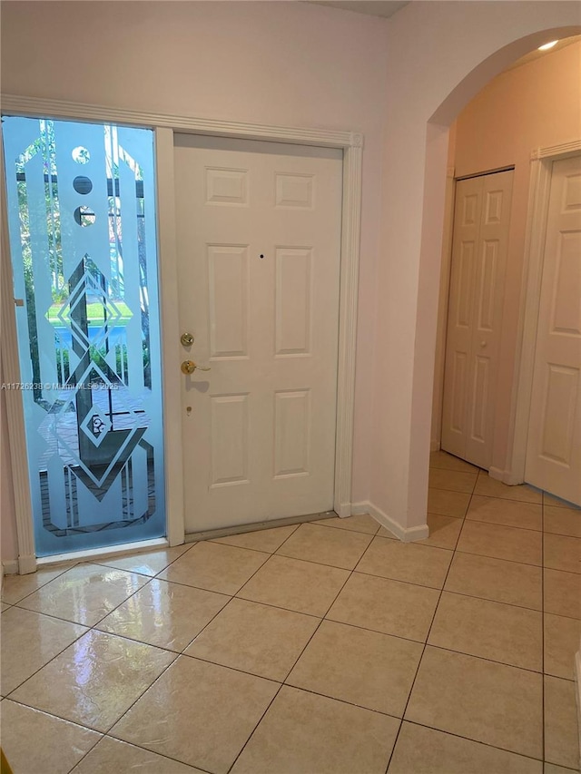 foyer featuring light tile patterned floors