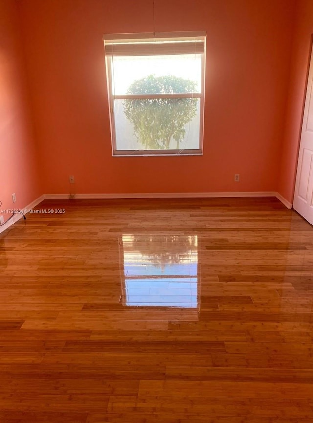 10495 S Utopia Cir S, Boynton Beach, FL 33437 - unfurnished room with wood finished floors