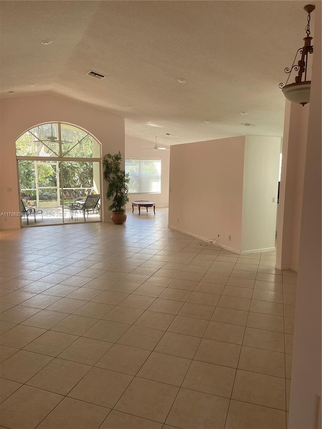10495 S Utopia Cir S, Boynton Beach, FL 33437 - unfurnished room with vaulted ceiling and light tile patterned floors
