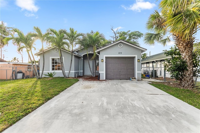 ranch-style home with a garage and a front yard