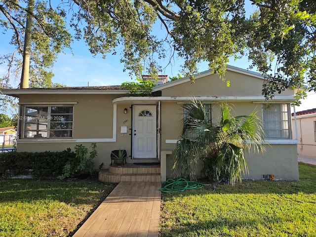 view of front of home with a front yard