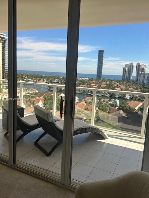 balcony featuring a water view