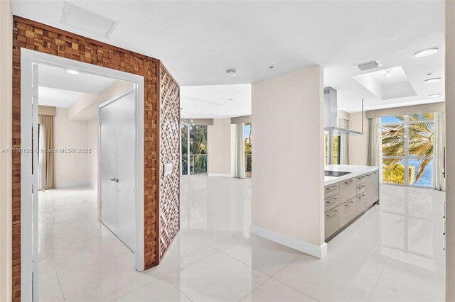 hallway with light tile patterned flooring