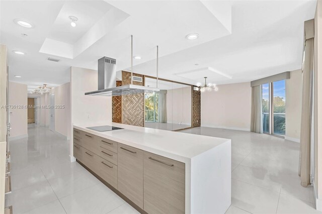 kitchen featuring white cabinetry, light tile patterned floors, black electric cooktop, sink, and island range hood