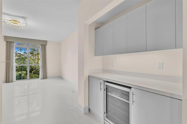 hall featuring light tile patterned flooring