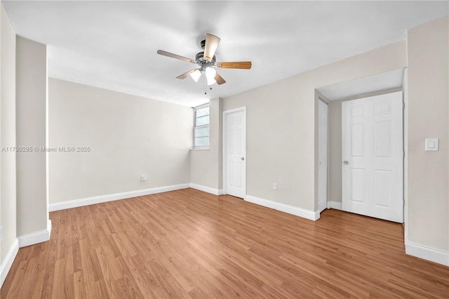 unfurnished room with light wood-type flooring and ceiling fan