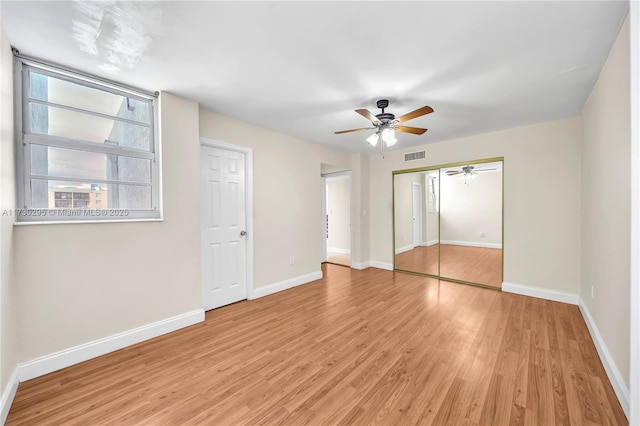 unfurnished bedroom featuring ceiling fan and light hardwood / wood-style floors