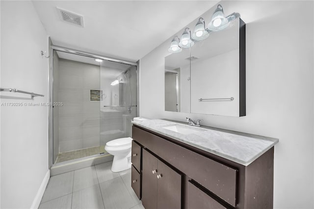 bathroom with toilet, tile patterned flooring, walk in shower, and vanity