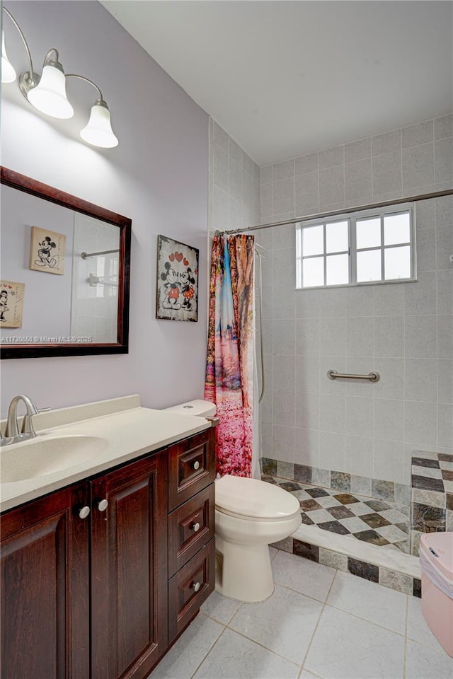 bathroom with a shower with curtain, toilet, tile patterned flooring, and vanity