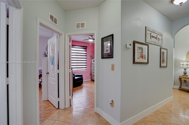 corridor with light tile patterned floors