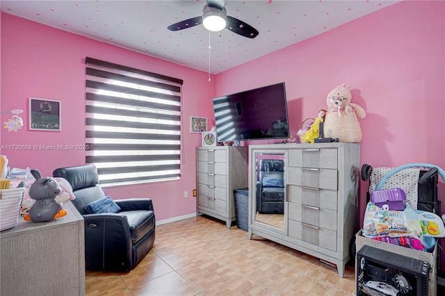 living area with ceiling fan