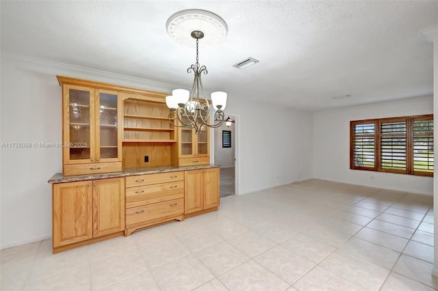 dining area with an inviting chandelier, light tile patterned floors, a textured ceiling, visible vents, and baseboards
