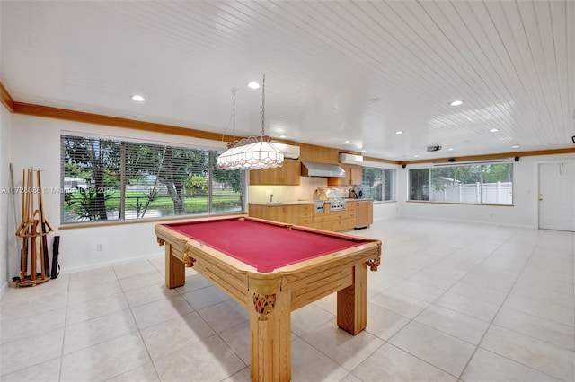 recreation room featuring crown molding, light tile patterned flooring, baseboards, and recessed lighting