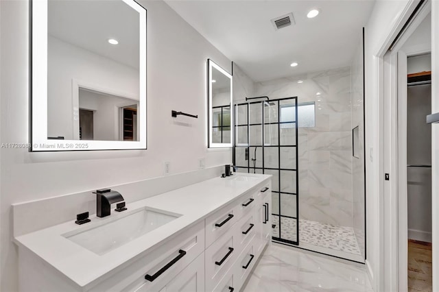 full bath with a sink, visible vents, a shower stall, and marble finish floor