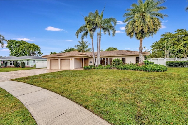 ranch-style home with an attached garage, driveway, stucco siding, and fence