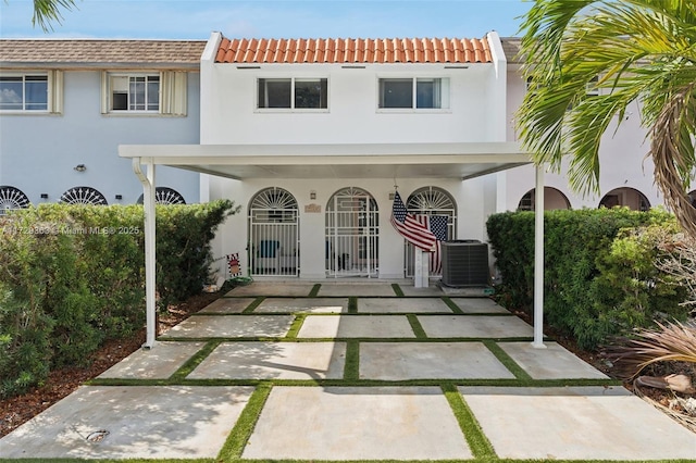 back of property featuring central AC unit