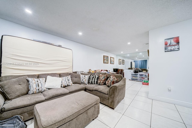 tiled living room with a textured ceiling