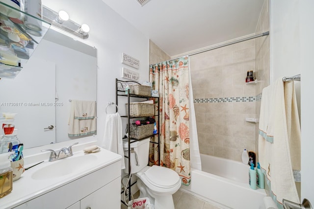 full bathroom with vanity, toilet, shower / bath combo with shower curtain, and tile patterned flooring