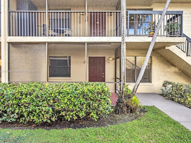 entrance to property with a balcony