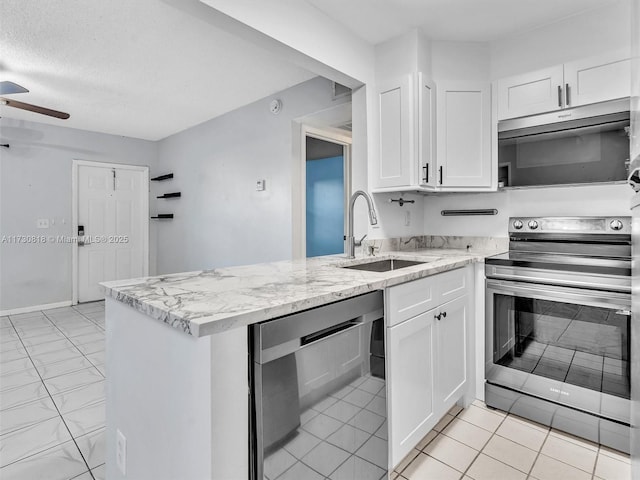 kitchen with sink, white cabinetry, and appliances with stainless steel finishes