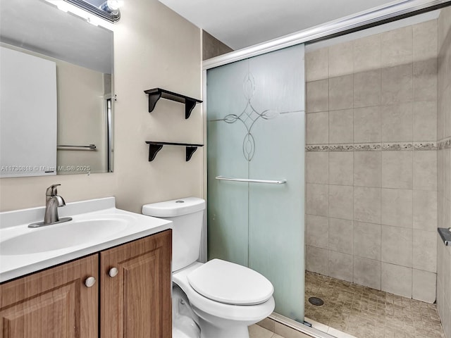 bathroom featuring vanity, toilet, and walk in shower