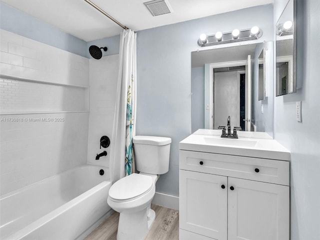 full bathroom with vanity, toilet, shower / bath combination with curtain, and hardwood / wood-style floors