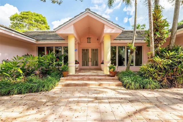 12845 SW 107th Ct, Miami, FL 33176 - view of exterior entry featuring french doors and stucco siding
