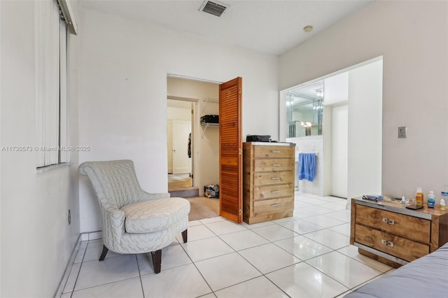 bedroom featuring light tile patterned floors