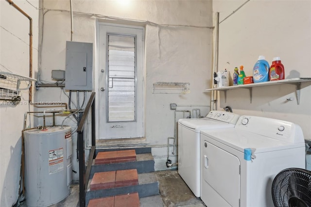 clothes washing area featuring electric panel, electric water heater, and washing machine and dryer