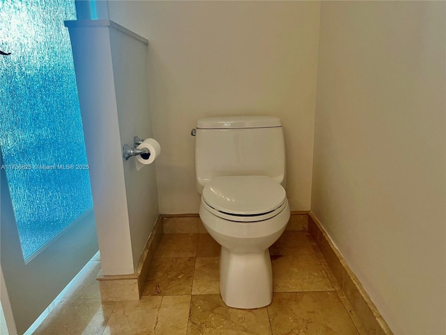 bathroom featuring toilet