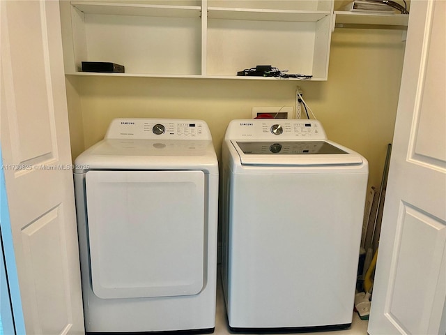 washroom featuring washing machine and dryer