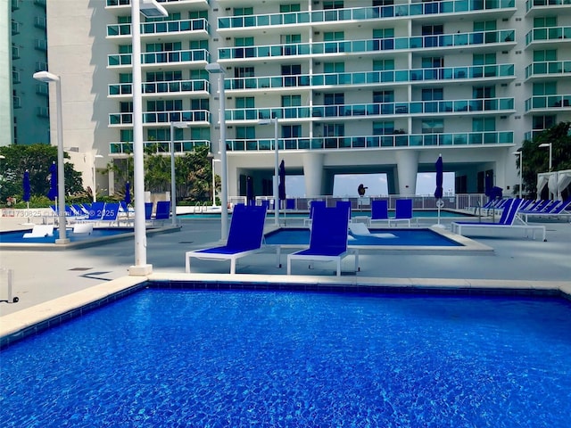 view of swimming pool featuring a patio