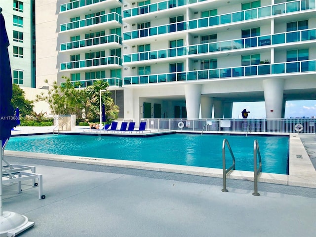 view of swimming pool featuring a patio