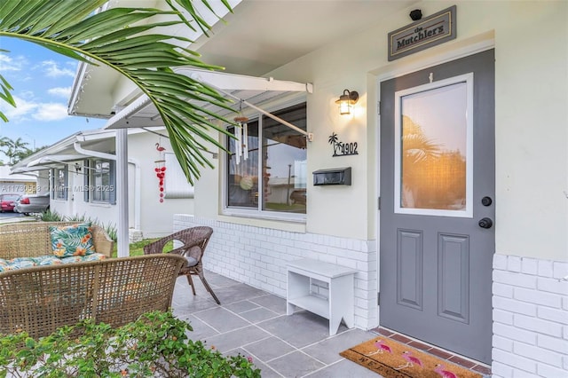 entrance to property with outdoor lounge area