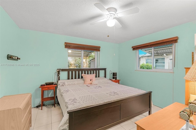 bedroom with light tile patterned floors and ceiling fan