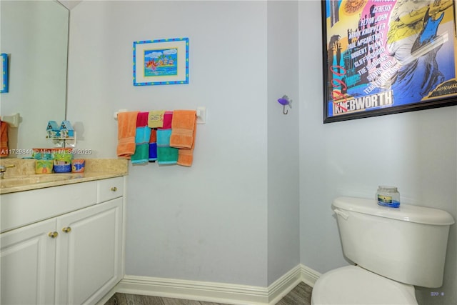 bathroom with toilet and vanity