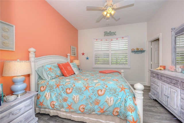 bedroom with ceiling fan and light hardwood / wood-style flooring