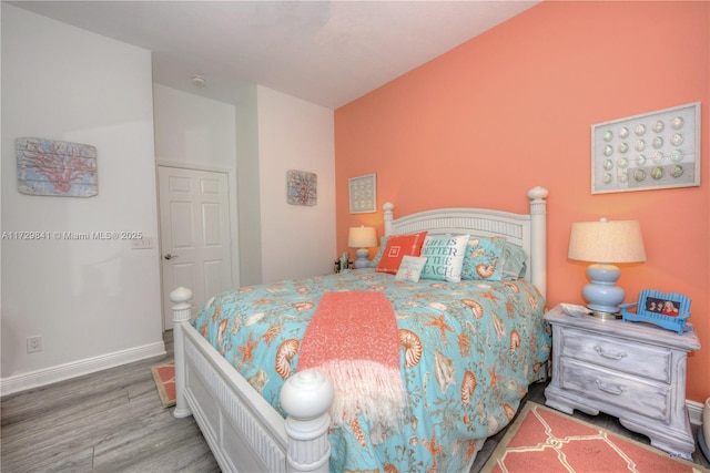 bedroom with hardwood / wood-style flooring