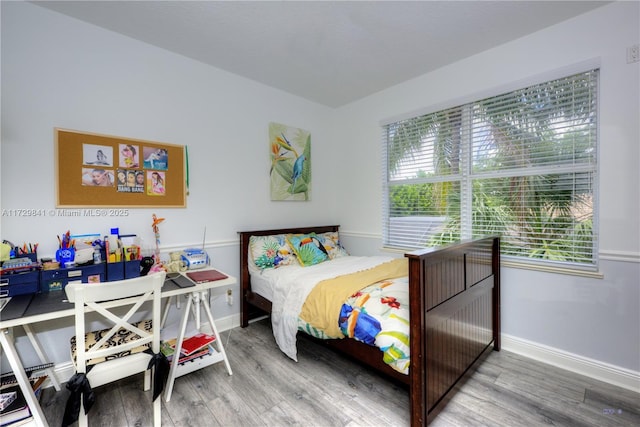 bedroom featuring hardwood / wood-style floors